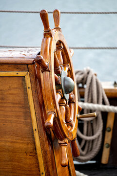 wooden ship's wheel of a tall ship