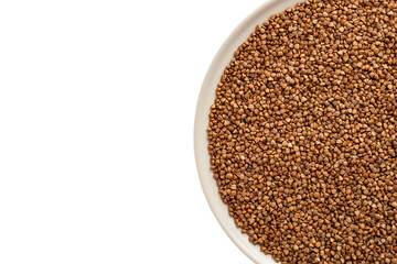 Buckwheat grits poured into a cup, buckwheat porridge, buckwheat kernels not boiled, dietary vegan food