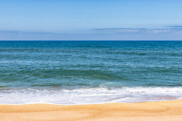 Fototapeta na wymiar View of a beautiful atlantic ocean from Praia do Norte in Nazare, Portugal.