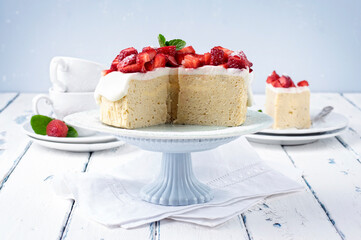 Traditional German cheesecake with strawberry fruits served as close-up in a cake dish on a wooden with copy space
