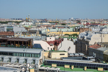 panoramic view of the roofs of the historical buildings of the city from the observation deck of St. Isaac's Cathedral on a clear sunny summer day and a copy space in Saint-Petersburg