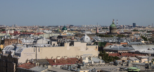 panoramic view of the roofs of the historical buildings of the city from the observation deck of St. Isaac's Cathedral on a clear sunny summer day and a copy space in Saint-Petersburg