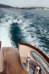 view from the yacht to the sea and a tied inflatable boat - 447571074