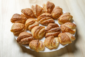 Freshly prepared pastries with a crispy crust are on a plate.