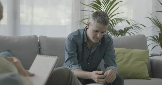 Man having a therapy session with a professional psychologist