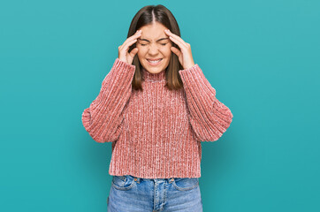 Young beautiful woman wearing casual clothes with hand on head for pain in head because stress....