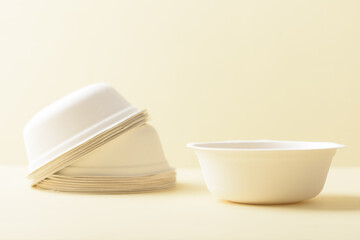 Biodegradable paper cup on yellow background. Eco-friendly sustainable products concept zero waste lifestyle. Minimalism simple and copy space