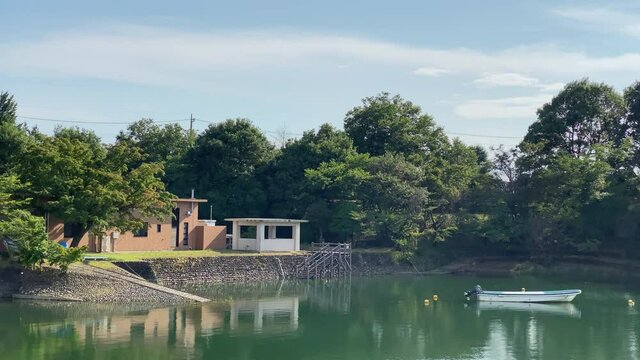 Lake sayama at Tokyo Japan. Impressive sky with clear horizon and beautiful scenery, there is an intake tower.