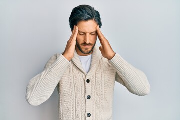 Young hispanic man wearing casual clothes with hand on head, headache because stress. suffering migraine.