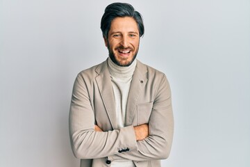 Young hispanic man with arms crossed gesture smiling and laughing hard out loud because funny crazy joke.