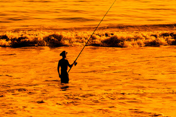 Surf Fishing on sunset beach in California