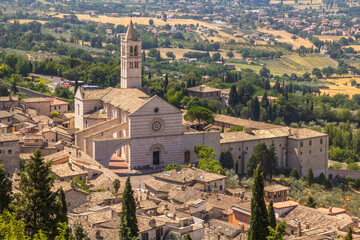 Landscape view of Assisi, Perugia, Italy depicting the Saint Clare Basilica - 447595883
