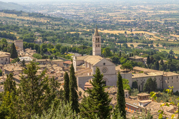 Landscape view of Assisi, Perugia, Italy depicting the Saint Clare Basilica - 447595894