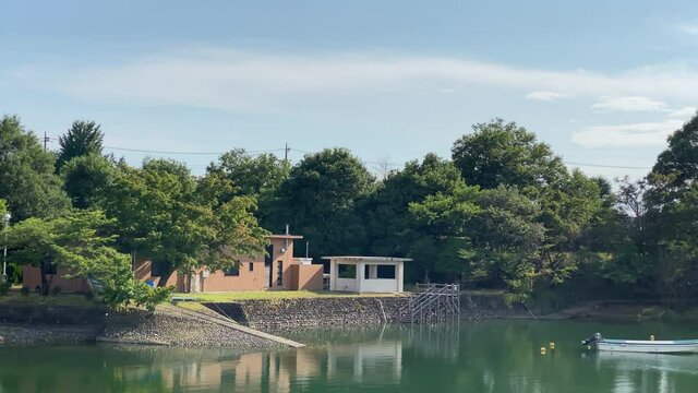 Lake sayama at Tokyo Japan. Impressive sky with clear horizon and beautiful scenery, there is an intake tower.