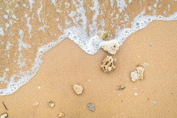 sand beach with rock and water