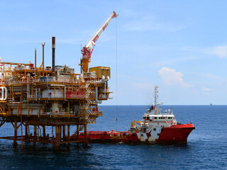 Supply boat transfer the cargo for supporting oil and gas industry and moving cargo from the boat...
