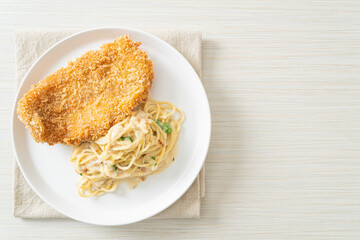 spaghetti pasta white cream sauce with fried fish