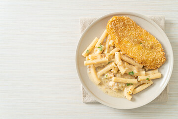 quadrotto penne pasta white cream sauce with fried fish
