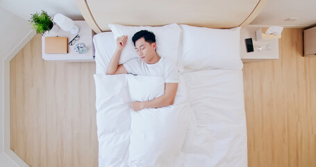 man sleeping well in bed