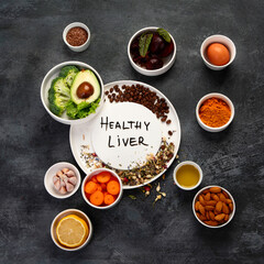 Fototapeta na wymiar Best products for healthy liver on dark gray background. Clean eating concept.