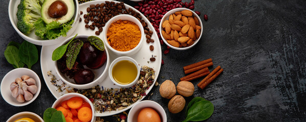 Best products for healthy liver on dark gray background. Clean eating concept.