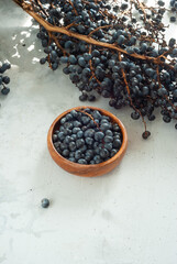 Fototapeta na wymiar Acai berries, a super healthy product with natural branch