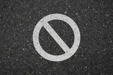Asphalt with prohibiting sign. Asphalt road drawn prohibition sign 
