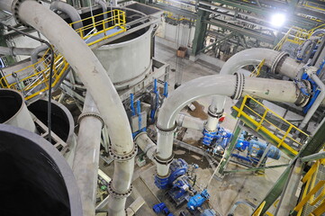 Obraz premium Pavlodar region, Kazakhstan - 12.10.2015 : Pipes and tanks with a centrifuge for processing sulfide ore
