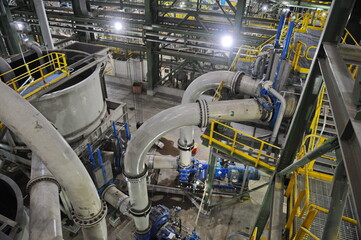 Pavlodar region, Kazakhstan - 12.10.2015 : Pipes and tanks with a centrifuge for processing sulfide...