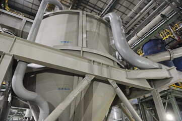 Pavlodar region, Kazakhstan - 12.10.2015 : Pipes and tanks with a centrifuge for processing sulfide...
