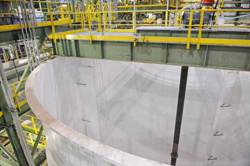 Pavlodar region, Kazakhstan - 12.10.2015 : Pipes and tanks with a centrifuge for processing sulfide...