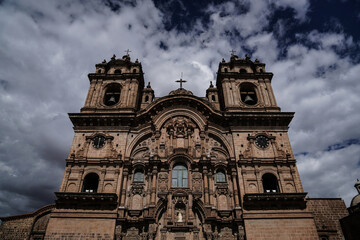 ancient church with many details with cloudy sky in background