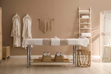 Poster Stylish spa salon interior with massage table © New Africa