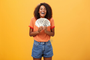 Finally girl rich. Portrait of happy charismatic stylish young female model receiving first payment...