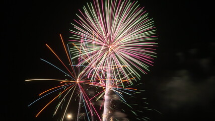 beautiful and colorful fireworks exploding during fourth of july