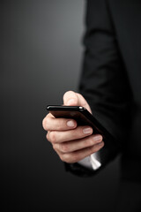 Businessman using smart phone in hands