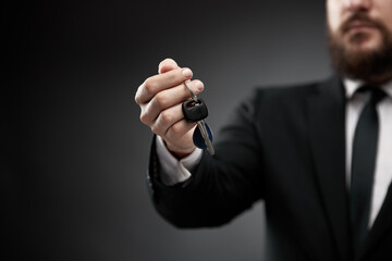 Man holding car keys in hand