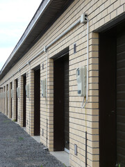 New brick garages. Modern garages are lined up. Car storage space.