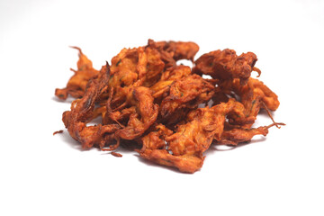 Fried onion pakora or Pyaj Pakoda also known as Crispy Kanda bhaji, Bhajji, bajji, favourite Indian Tea-Time snack during the rainy season. served with tomato ketchup