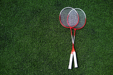 children's game of badminton racket and ruffle on the field