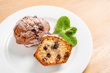 Fruitcake with raisin on plate