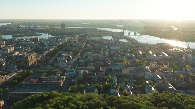 Aerial view of church and cyti. City At Sunset. Aerial view of small old european town. Aerial panoramic view of historic brick buildings. 