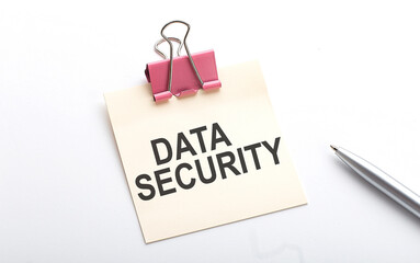 DATA SECURITY text on the sticker with pen on the white background