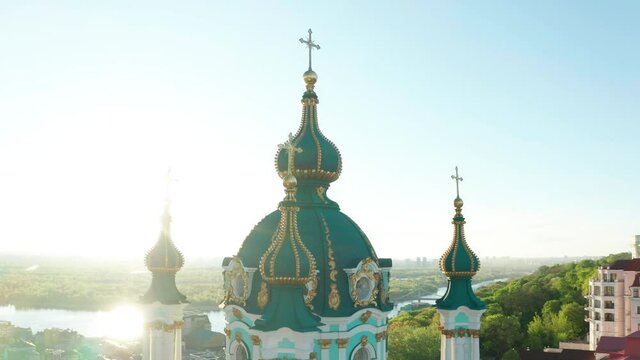 Aerial view of church and cyti. City At Sunset. Aerial view of small old european town. Aerial panoramic view of historic brick buildings. 