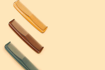 Plastic hair combs on color background