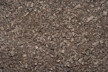 Waste wood at the factory. Thistle texture. Remains of wood after processing boards in a furniture factory.