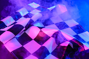Racing flag and smoke on dark background