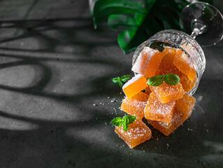 Homemade from mango and passionfruit jelly candies in sugar with mint. Homemade marmalade candy.
