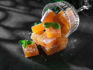 Homemade from mango and passionfruit jelly candies in sugar with mint. Homemade marmalade candy.