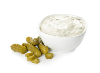 Bowl with tasty tartare sauce and pickled cucumbers on white background